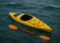 Kayaker demonstrating self rescue techniques in open water for safety and emergency preparedness
