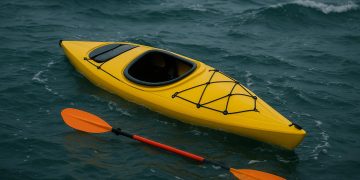 Kayaker demonstrating self rescue techniques in open water for safety and emergency preparedness