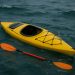 Kayaker demonstrating self rescue techniques in open water for safety and emergency preparedness