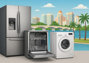 Appliance repair technician fixing a refrigerator in a Sarasota, FL home