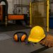 Modern sheet metal fabrication workshop with organized tools and advanced safety equipment in use