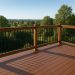 Sturdy safety barriers installed on a raised wooden deck with a modern balcony design